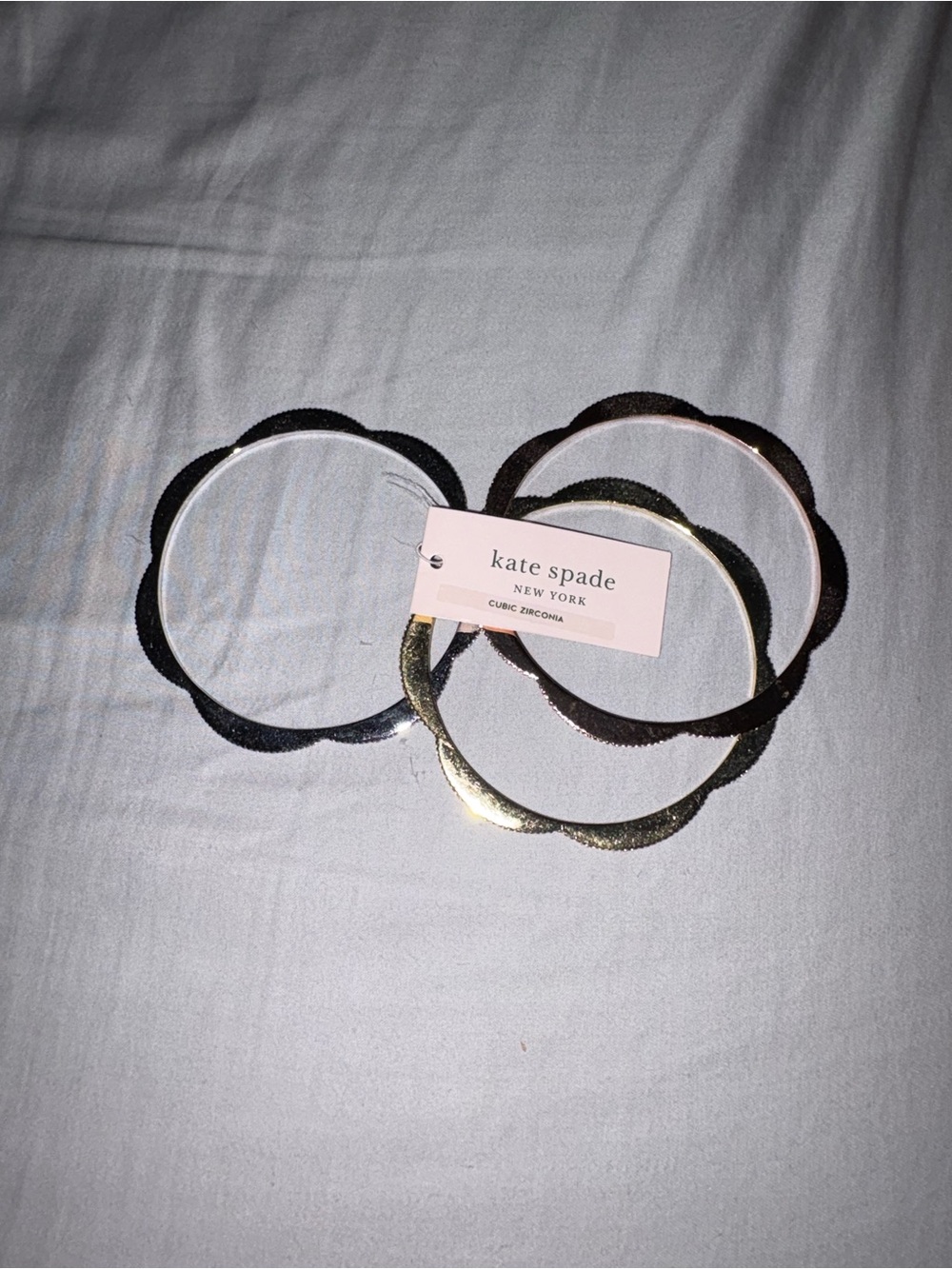kate spade scalloped bangle set in gold, rose gold, and silver tones